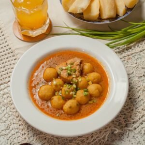 Delicious traditional Paraguayan soup with cassava served on a lace cloth.